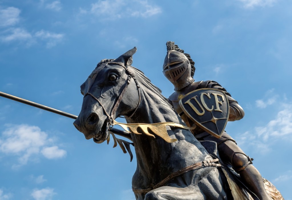 University of Central Florida knight statue against a blue sky.