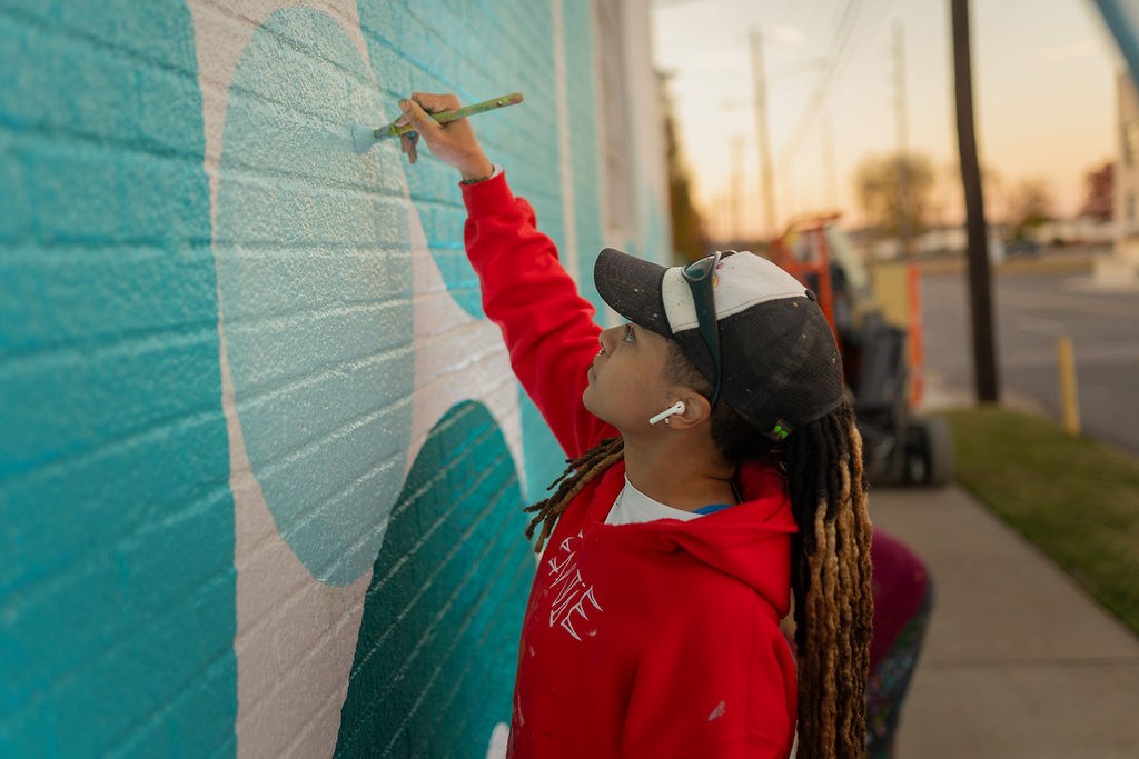 42 October 2026 events in Birmingham: Magic City Classic, Furnace Fest + more 4 person painting a mural on a brick wall