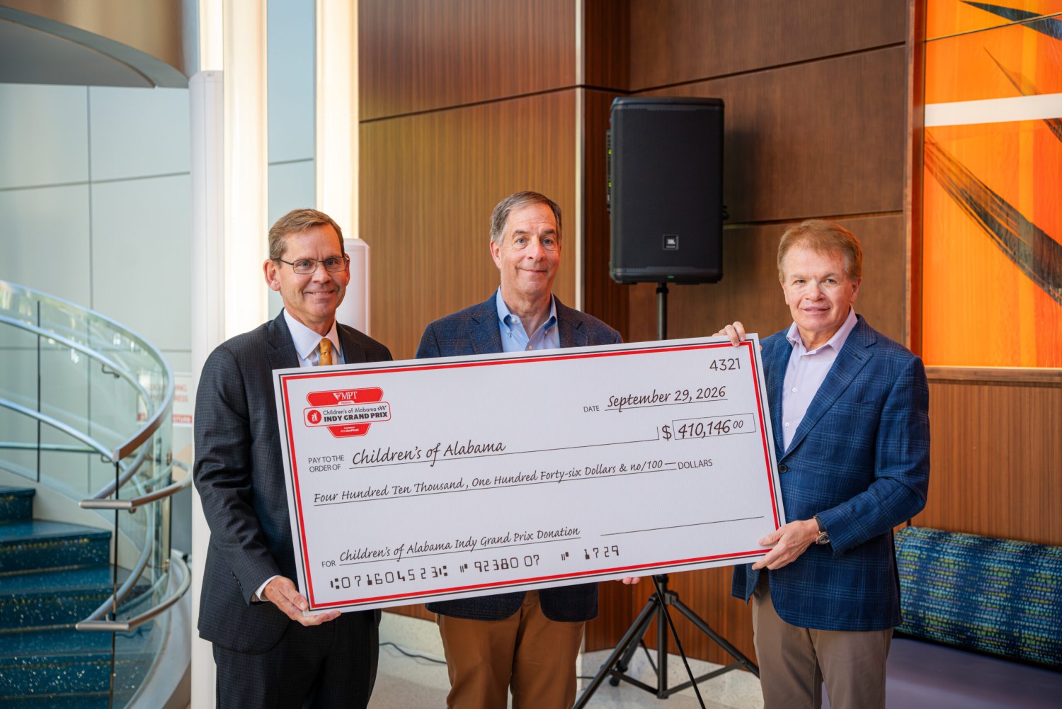 Children's of Alabama receives $410,416 donation from Children's of Alabama Indy Grand Prix 2 Three men holding a ceremonial check for $410,146 from the Indy Grand Prix presented to Children's of Alabama, dated September 29, 2026