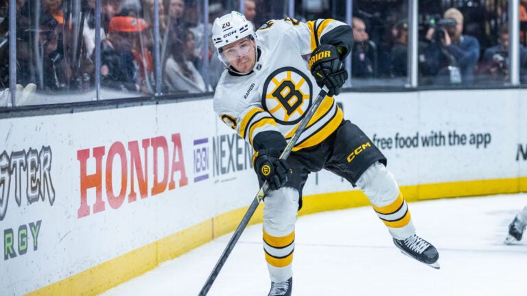 Boston Bruins defenseman Henri Jokiharju (20) passes the puck during the third period of an NHL hockey game against Anaheim Ducks, Wednesday, Nov. 19, 2025, in Anaheim, Calif.