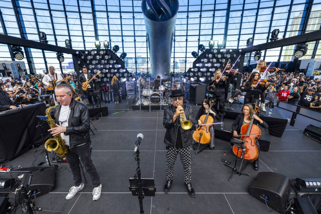 David Perrico and the Raiders House Band perform on stage before the team faces the Miami Dolph ...