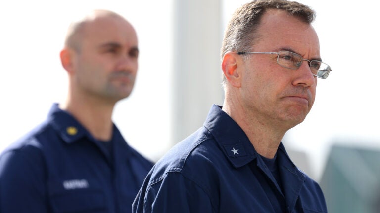 Coast Guard Rear Admiral Matt Lake speaks to reporters during Sunday's press conference at the United States Coast Guard Base in Boston.